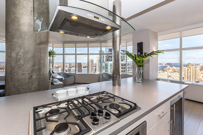Customer kitchen with the Proline PLFI 544 - Ducted Island Range Hood, 600 CFM | Stainless Steel Finish