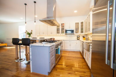 Customer kitchen with the Proline PLFI 520 - Ducted Island Range Hood, 600/1100 CFM | Stainless Steel Finish