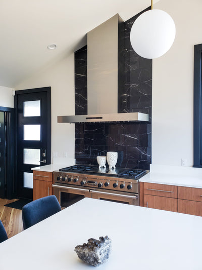 Customer kitchen with the Proline PLFW 755 - Ducted Wall-Mounted Range Hood, 1100 CFM | Stainless Steel, Outdoor Rated Finish Option