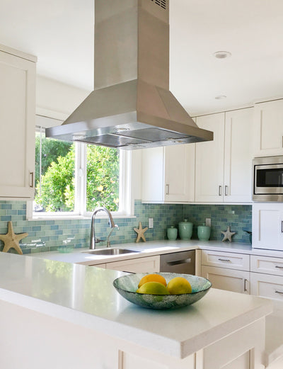 Customer kitchen with the Proline PLFI 520 - Ducted Island Range Hood, 600/1100 CFM | Stainless Steel Finish