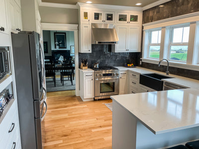 Customer kitchen with the Proline PLJW 101 - Ducted Under-Cabinet Range Hood, 1000/2000 CFM | Stainless Steel Finish