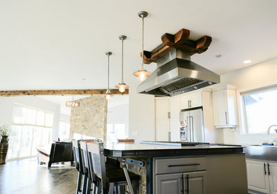 Customer kitchen with the Proline ProVI - Ducted Island Range Hood, Variable CFM | Stainless Steel, Outdoor Rated Finish Option