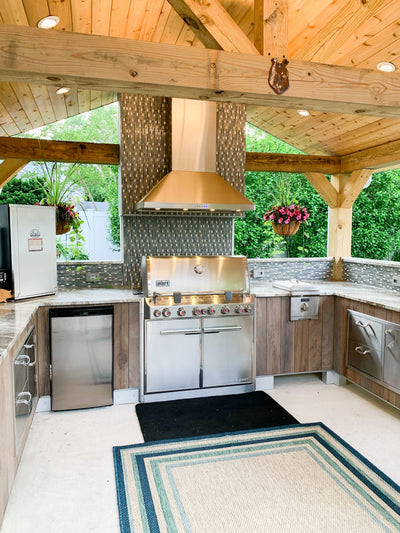Customer kitchen with the Proline PLJW 129 - Ducted Indoor/Outdoor Wall-Mounted Range Hood, 900/1200 CFM | Stainless Steel Finish