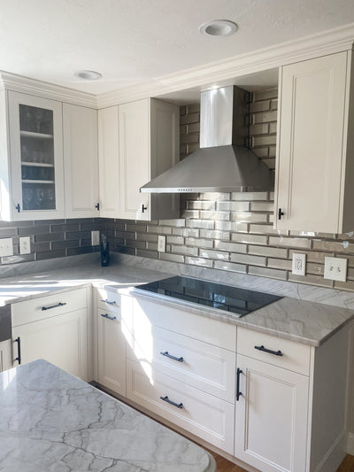 Customer kitchen with the Proline PLJW 129 - Ducted Indoor/Outdoor Wall-Mounted Range Hood, 900/1200 CFM | Stainless Steel Finish