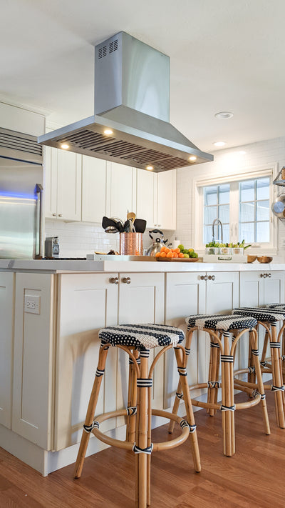 Customer kitchen with the Proline PLFI 520 - Ducted Island Range Hood, 600/1100 CFM | Stainless Steel Finish