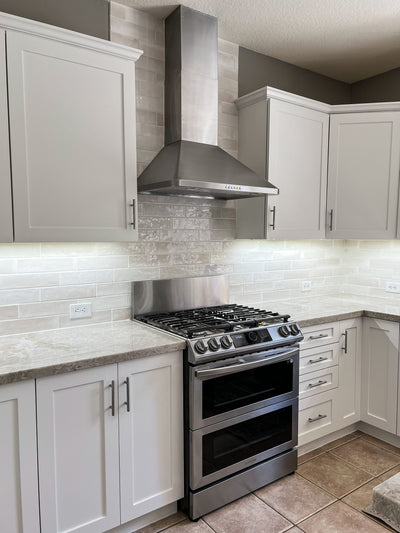 Customer kitchen with the Proline PLJW 129 - Ducted Indoor/Outdoor Wall-Mounted Range Hood, 900/1200 CFM | Stainless Steel Finish