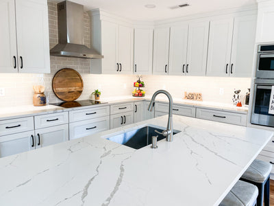 Customer kitchen with the Proline PLFW 520 - Wall-Mounted Range Hood, 600/1200 CFM | Convertible to Ductless, Stainless Steel, Matte Black Finish