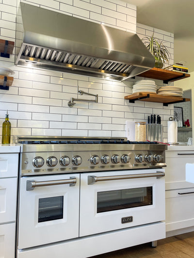Customer kitchen with the Proline PLJW 109 - Wall-Mounted Range Hood, 1000/2000 CFM | Convertible to Ductless, Stainless Steel Finish, Outdoor Rated