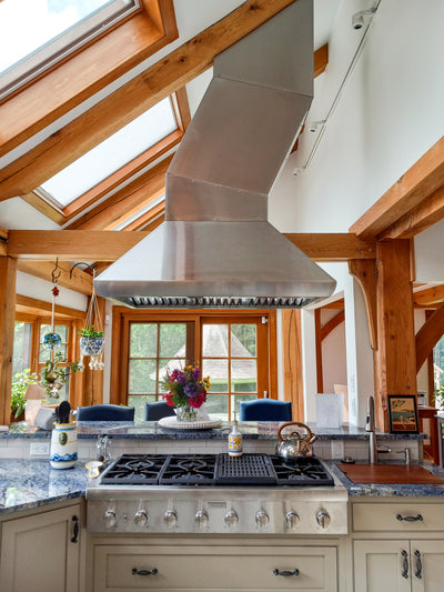 Customer kitchen with the Proline PLJI 109 - Ducted Island Range Hood, 1200 CFM | Stainless Steel Finish