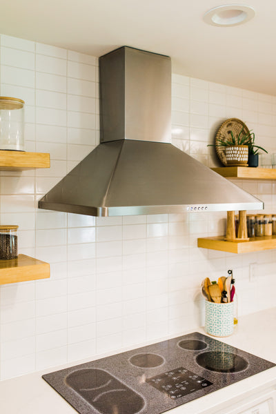 Customer kitchen with the Proline PLJW 129 - Ducted Indoor/Outdoor Wall-Mounted Range Hood, 900/1200 CFM | Stainless Steel Finish