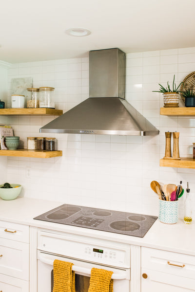 Customer kitchen with the Proline PLJW 129 - Ducted Indoor/Outdoor Wall-Mounted Range Hood, 900/1200 CFM | Stainless Steel Finish