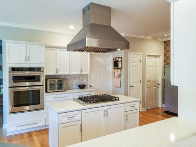 Customer kitchen with the Proline PLJI 103 - Ducted Island Range Hood, 1200 CFM | Stainless Steel Finish, Outdoor Rated Finish Option