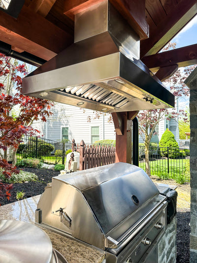 Customer kitchen with the Proline ProVI - Ducted Island Range Hood, Variable CFM | Stainless Steel, Outdoor Rated Finish Option