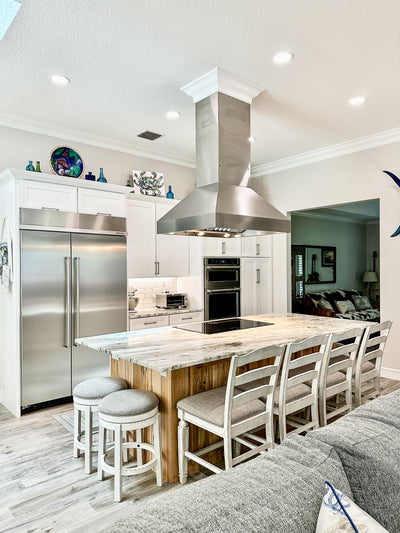 Customer kitchen with the Proline ProVI - Ducted Island Range Hood, Variable CFM | Stainless Steel, Outdoor Rated Finish Option