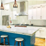 PLSW ProS Wall Mount Range Hood from ProlineRangeHoods.com above a gas stove in a white kitchen.
