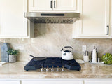 PLSW 185 stainless steel under-cabinet range hood above a gas stovetop by ProlineRangeHoods.com.
