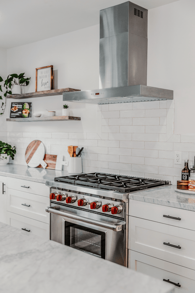 Customer kitchen with the Proline PLFW 750 - Ducted Wall-Mounted Range Hood, 900/1100 CFM | Stainless Steel Finish