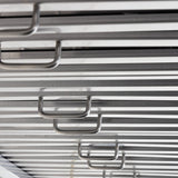 Close-up of metal handles on the stainless steel design, reminiscent of ProlineRangeHoods.com PLSW 116 Under-Cabinet Hood.