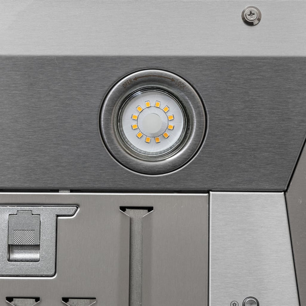 Close-up of a round LED on stainless ProlineRangeHoods.com PLGL Classic Range Hood Insert/Liner (ducted, 1200 CFM).