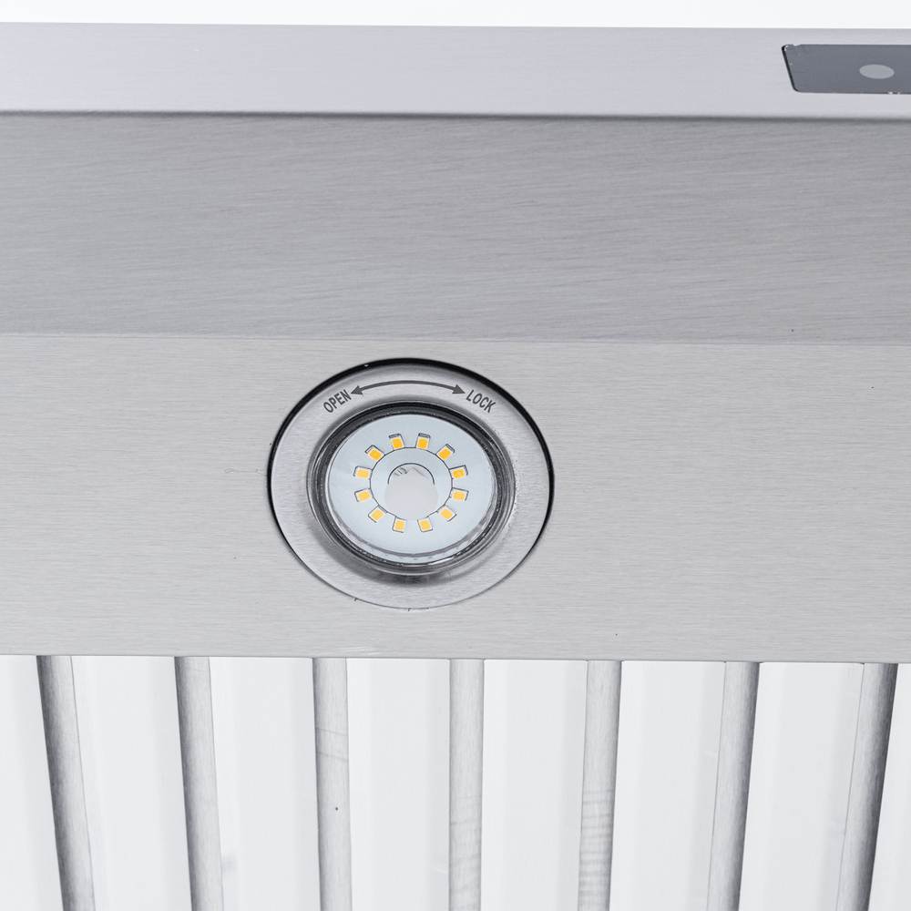 Close-up of LED light with lock/unlock indicator on Proline PLFW 129 E range hood, 900 CFM, stainless steel. ProlineRangeHoods.com.