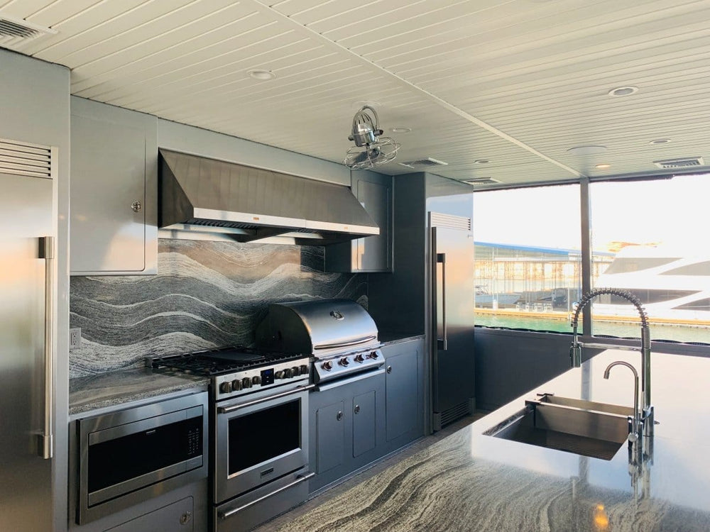 A contemporary kitchen with a Proline PLFW 832 range hood, sleek finish, low noise, 1000/2000 CFM—ProlineRangeHoods.com.