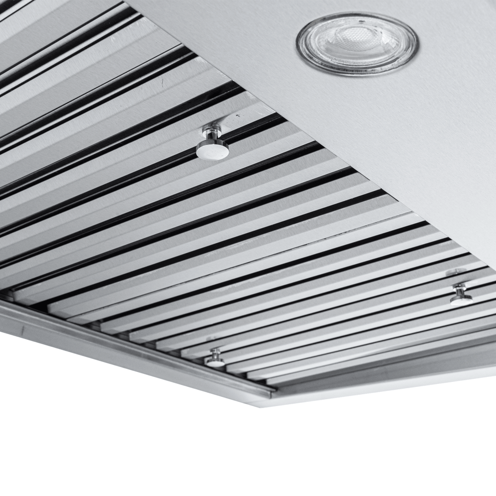 Modern ceiling with black beams, round recessed light, and Proline PLJW 117 Range Hood. ProlineRangeHoods.com.